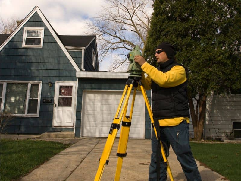 Property line survey being completed for a residential driveway expansion in Columbus Ohio